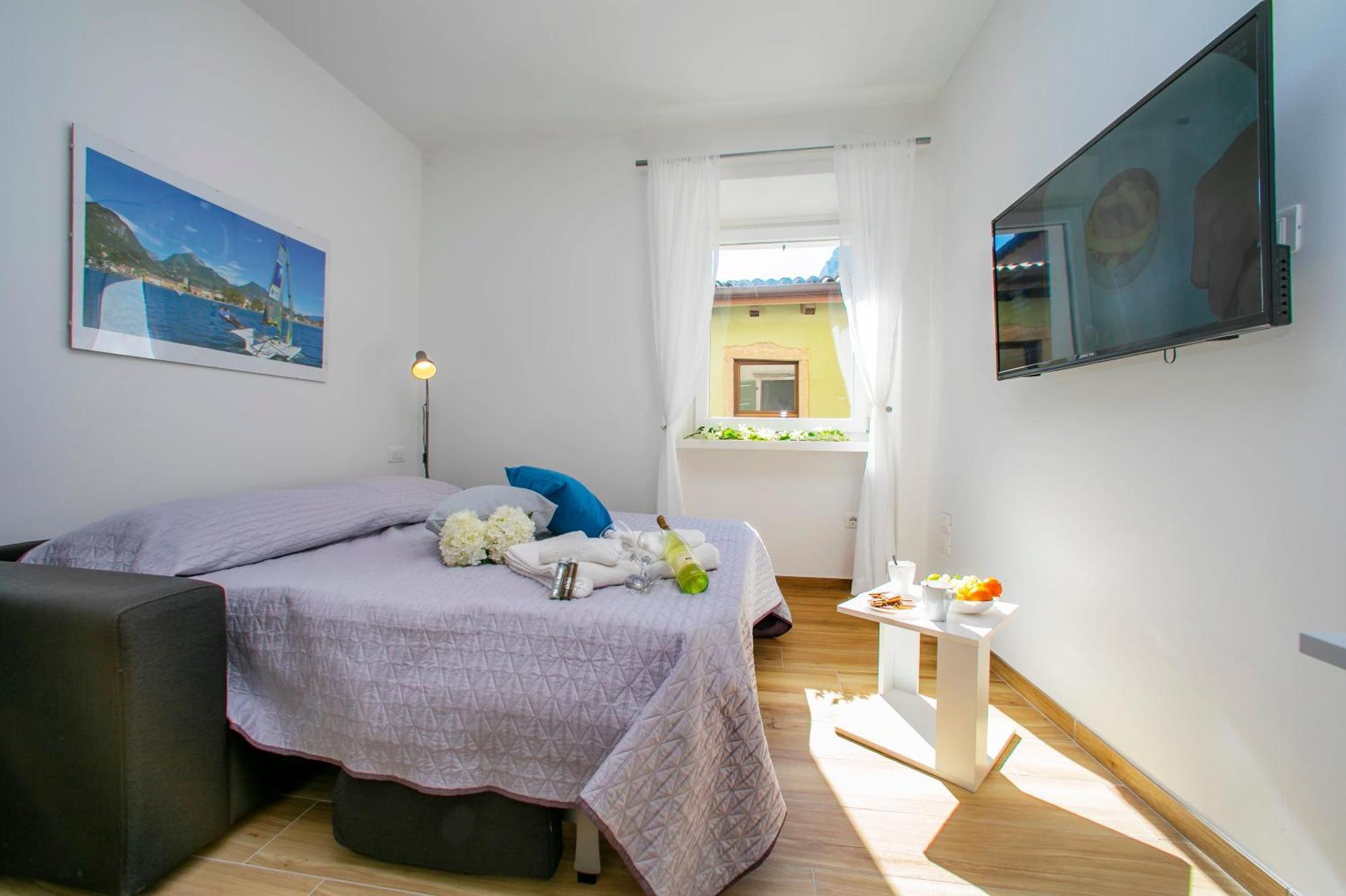 Nido Sui Tetti Di Riva Del Garda - Happy Rentals ภายนอก รูปภาพ